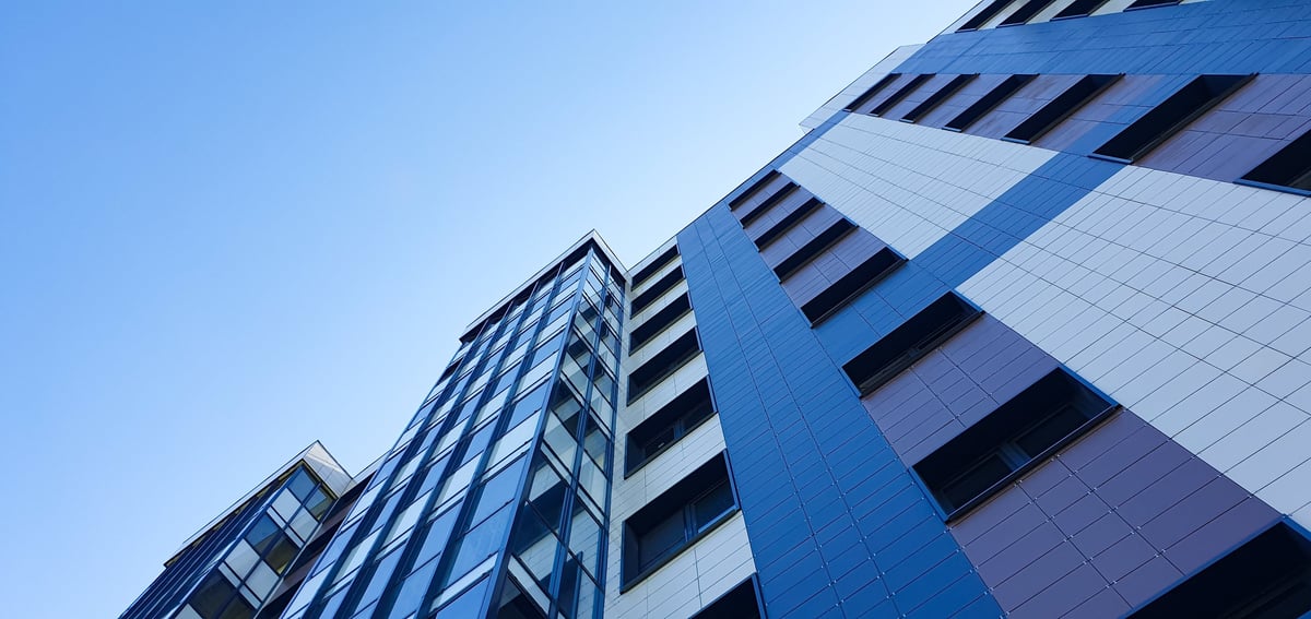 Residential apartment building representing property investment portfolio