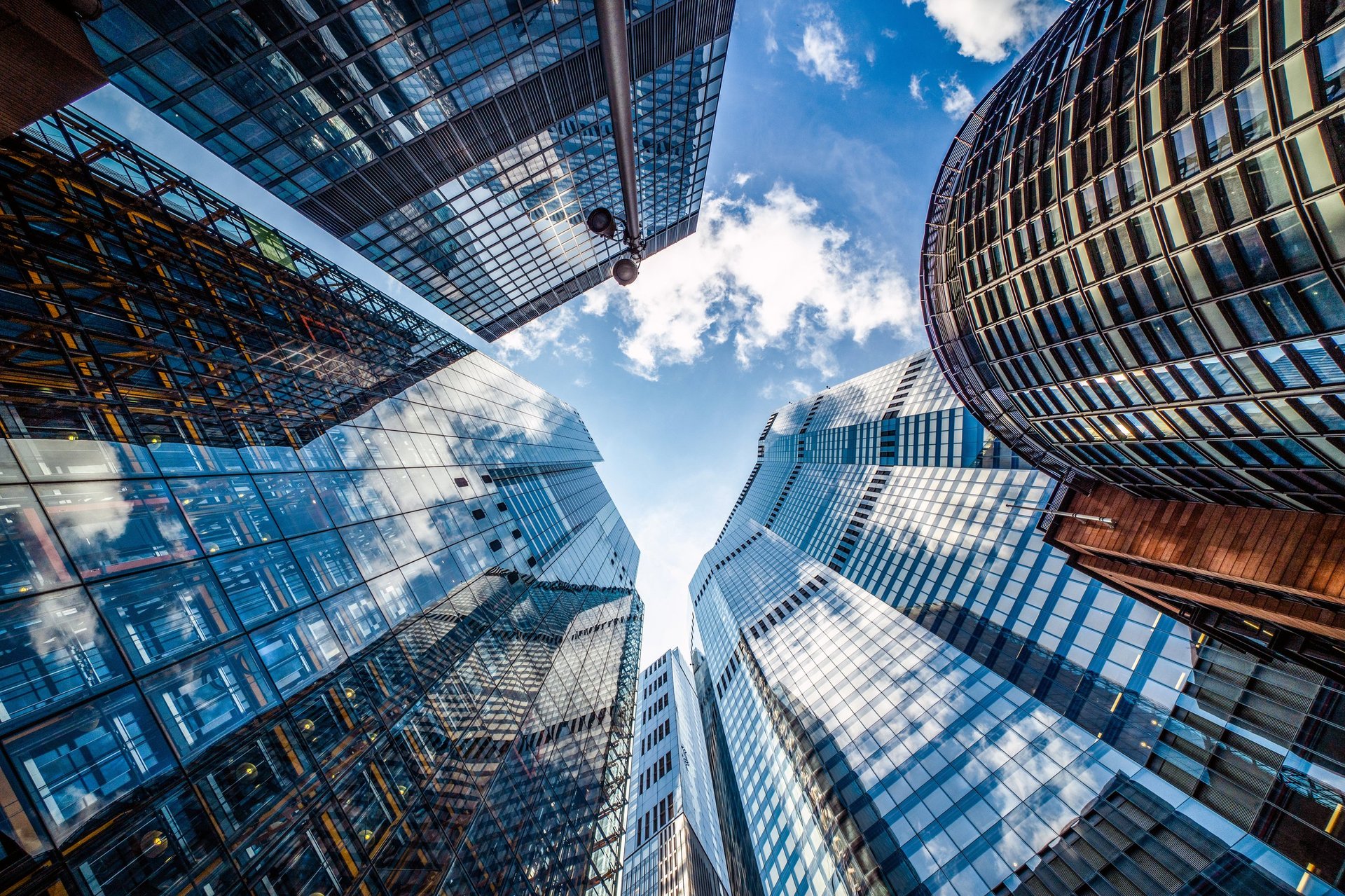 Modern glass skyscrapers representing corporate growth and investment